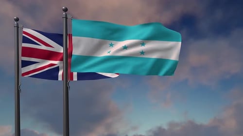 United Kingdom and Honduras National Flags Waving Against Cloudy Sky