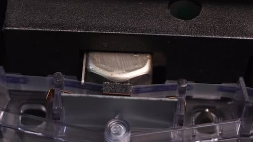 Cassette Tape Moving Across the Tape Head