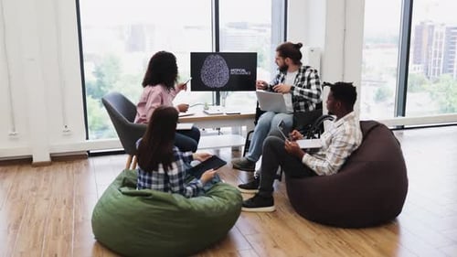 Team Discussing Artificial Intelligence Project in Modern Casual Office Setting