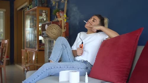 cigarette couch Young man smoking on sofa Stock Photo living room or office to create a stylish vintage look thats all your own. Cigarette burn on a sofa