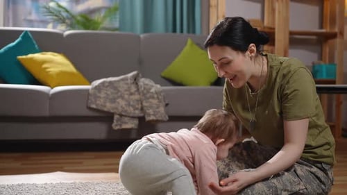 Military Mom Playing with Baby at Home