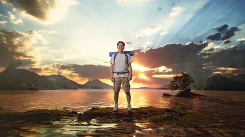 Full Body Of Asian Male Hiker Smiling To Camera At A Lake