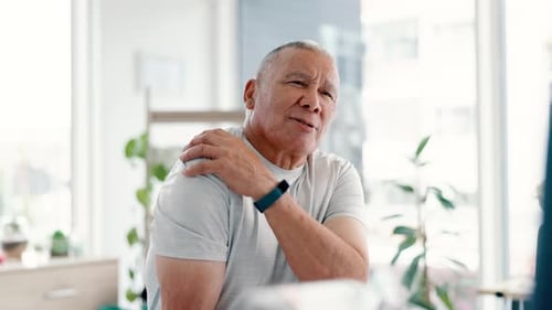Patient, doctor and consultation in surgery with shoulder pain, arthritis