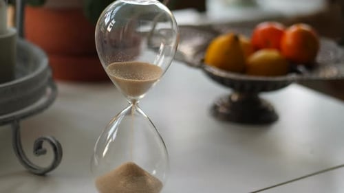 Sand Flowing Through an Hourglass Close Up