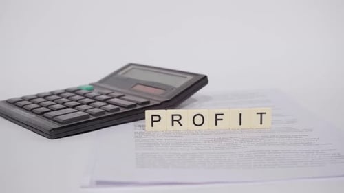 Calculator and the Word Profit with White Paper