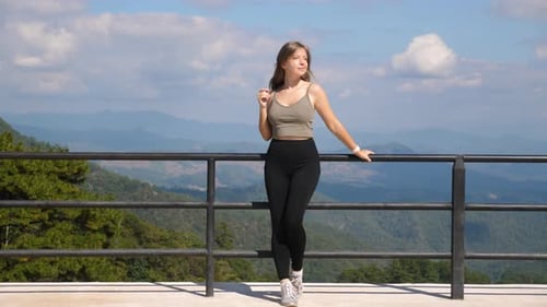 Young Millennial Traveler Enjoy Mountain Valley View on Viewpoint