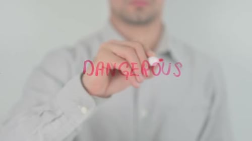 Hand Writes "Dangerous" with Red Marker