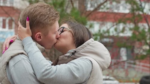 Romantic Couple Kissing in City Park