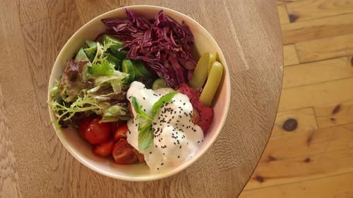 Fresh Healthy Salad Bowl on a Wooden Table