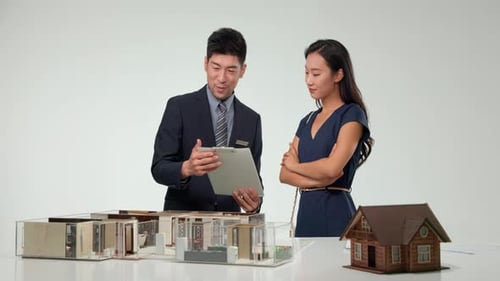 Real estate broker advising client or coworkers working discussing together with real estate brokers