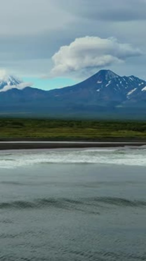 Beach with Black Sand and Volcano