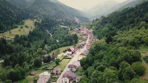 Drone shot showing a village in the Italian side of the Alps. Drone flight in South Tyrol in 4k