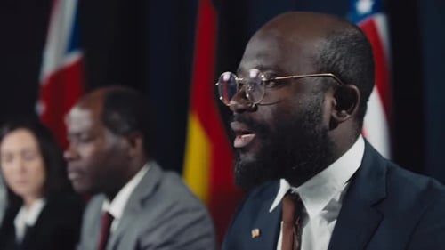 African American Minister Delivering Emotional Speech at International Summit