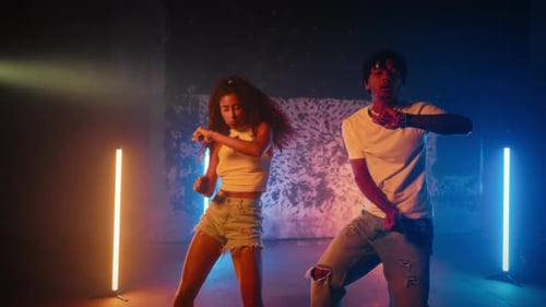 Dancehall Performers Moving Synchronously in Dance Studio Black Man and Woman Joyful Young People