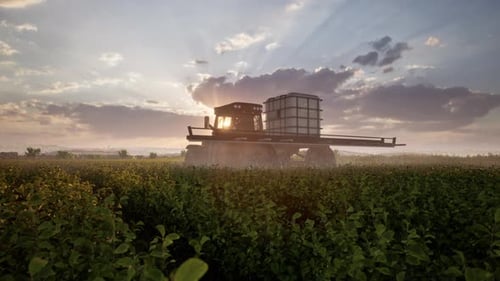Farming Tractor Plowing And Spraying On Field