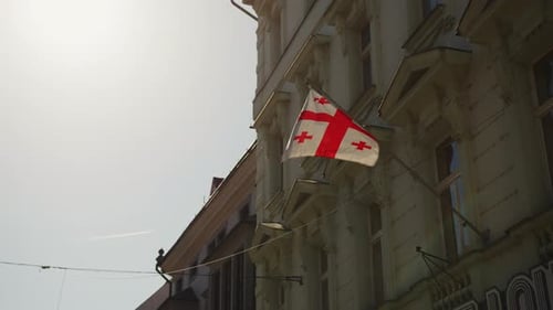 Georgian Flag Waving on Historic Building