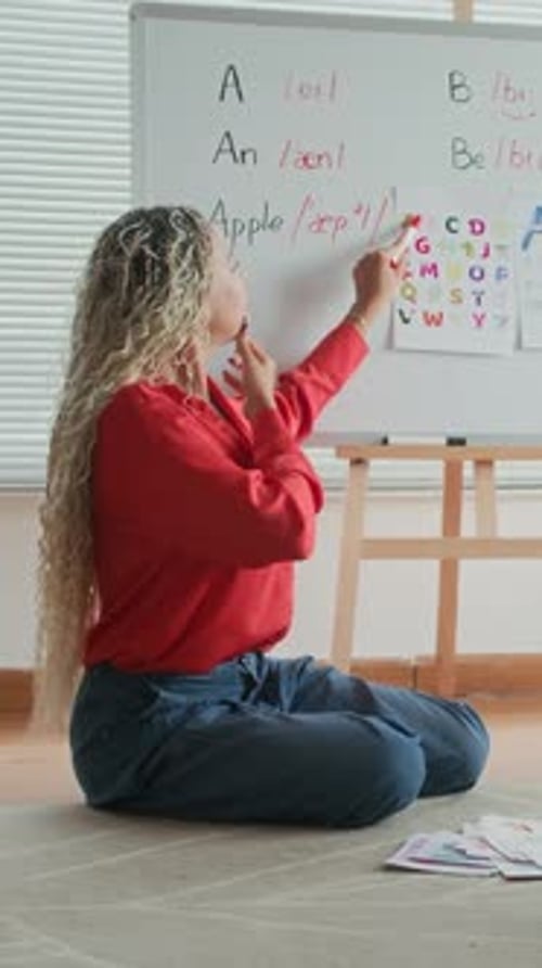 Woman Teaching Alphabet in Home Classroom