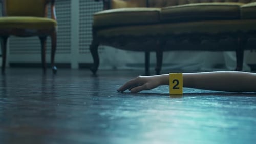 Evidence Marker Next to Arm at Crime Scene