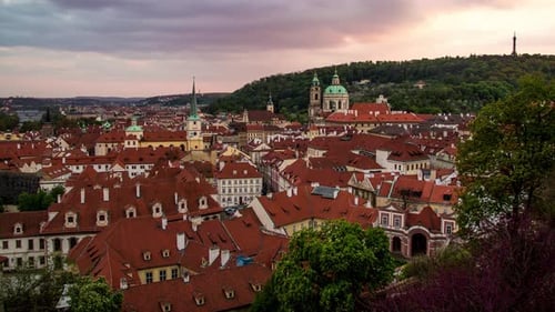 Day to night sunset timelapse from Prague, Czech Republic with a view of the red roofs of Malá Stran