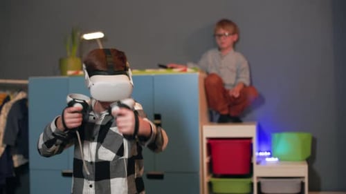 Boy with VR Headset and Hand Controllers