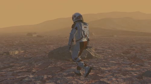 Astronaut Wearing Space Suit Walking on the Surface of