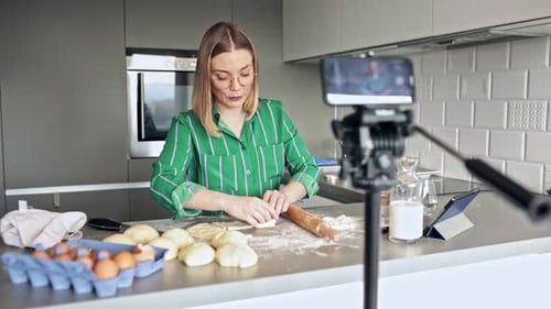 Woman Baking Dough and Recording Video in Kitchen
