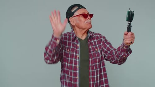 Man Blogger Take Selfie on Mobile Phone Selfie Stick Communicate Video Call Online with Subscribers