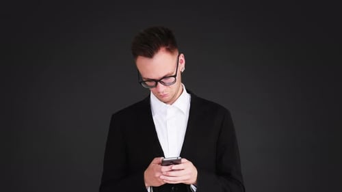 Young Adult Using Smartphone in Studio