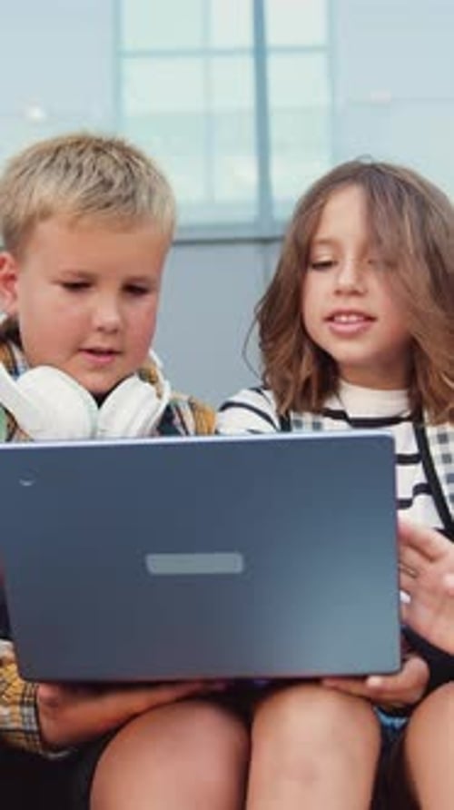 Back to School Group of Teenage School Children Using Laptop Sitting on Stairs Outside High School
