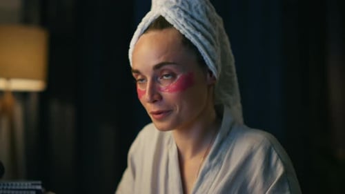 Woman with Under Eye Patches in Home Setting