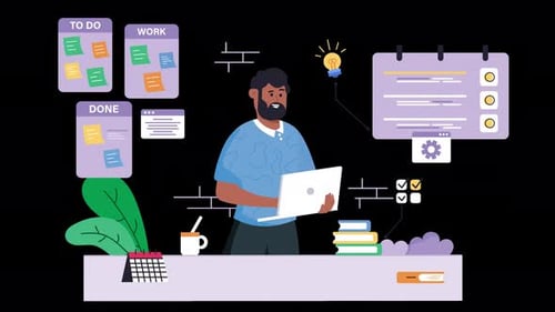 Black man working on a laptop in modern office environment.