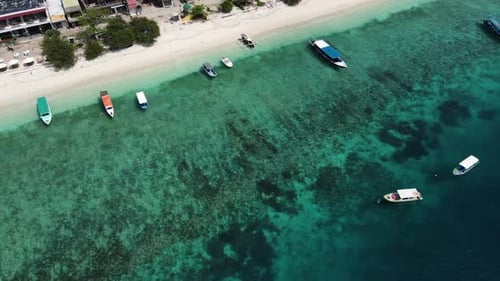Traditional Boats At The Coast Of Bali In Indonesia. Scenic Beach In Summer. aerial
