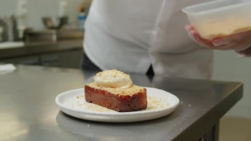 Chef Making a Brioche Dessert at the Kitchen Closeup Man Cooking an Order at the Restaurant Cafe Bar