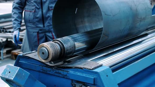 Engineers Serve Metal Rolling Machine in Industrial Workshop. Industrial Modern Technology. People
