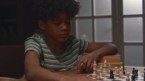 Tired Kids Playing Chess