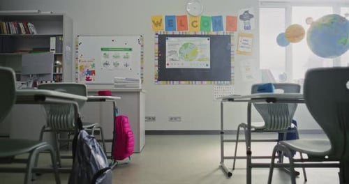 Interior of Modern Empty Elementary School Classroom with Desks for Students