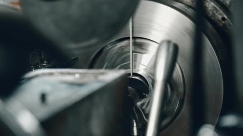 Precision lathe machine in action at metal workshop