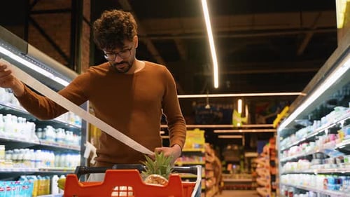 Arab Man Checking Receipt Surprised By Price Inflation
