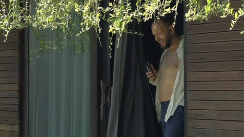 Young Man Listening to Music and Dancing in Garden, Super