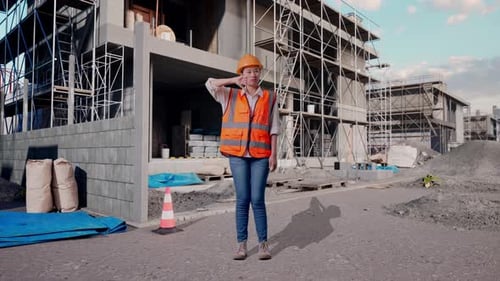 Asian Female Engineer Showing Thumbs Down Gesture And Shaking Her Head At Building Site