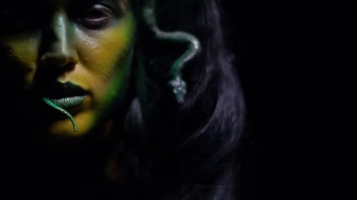 Close up of Medusa swallowing the snake