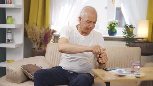 Man Experiencing Discomfort Taking Medication at Home