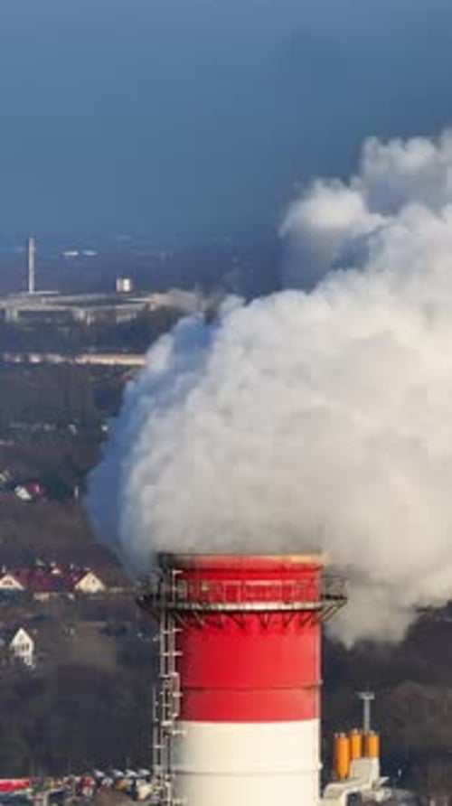 Industrial Smokestack Emitting Smoke in an Urban Area