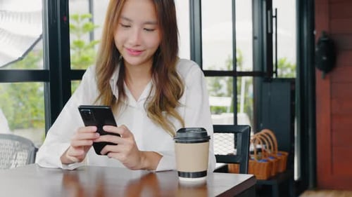 Happy Female Lifestyle Sitting in Cafe Near Window She Cellphone on Mobile Phone