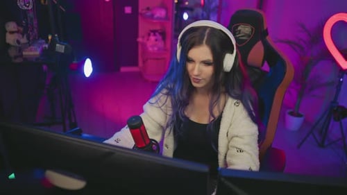 Curious Girl Gaming in Neon Lit Studio with Condenser Microphone