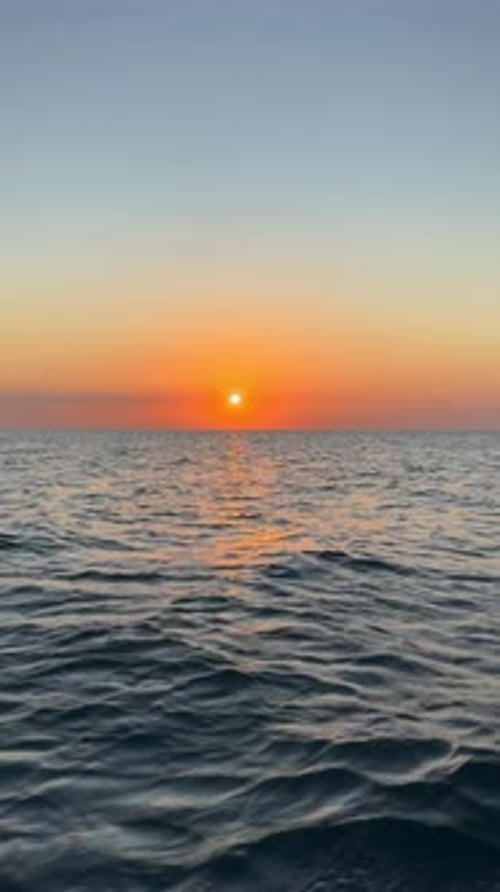 Water, ocean and ripple outside with sunset, summer holiday and relaxing