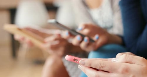 People Using Mobile Technology Close Up