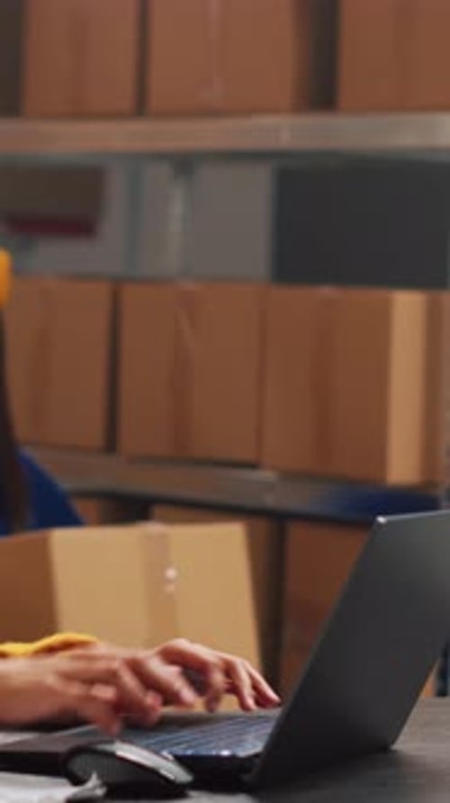 Warehouse Worker Receiving Box from Coworker