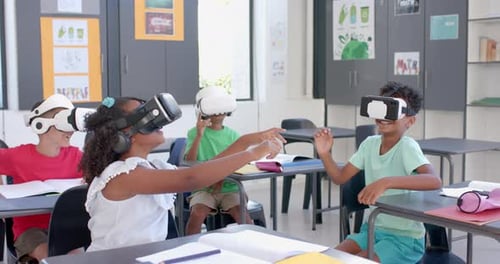 Biracial students explore virtual reality in a school, with copy space