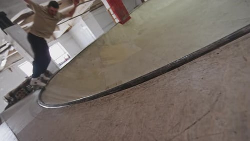 Man Riding on Ramp and Skating Bowl at Skatepark